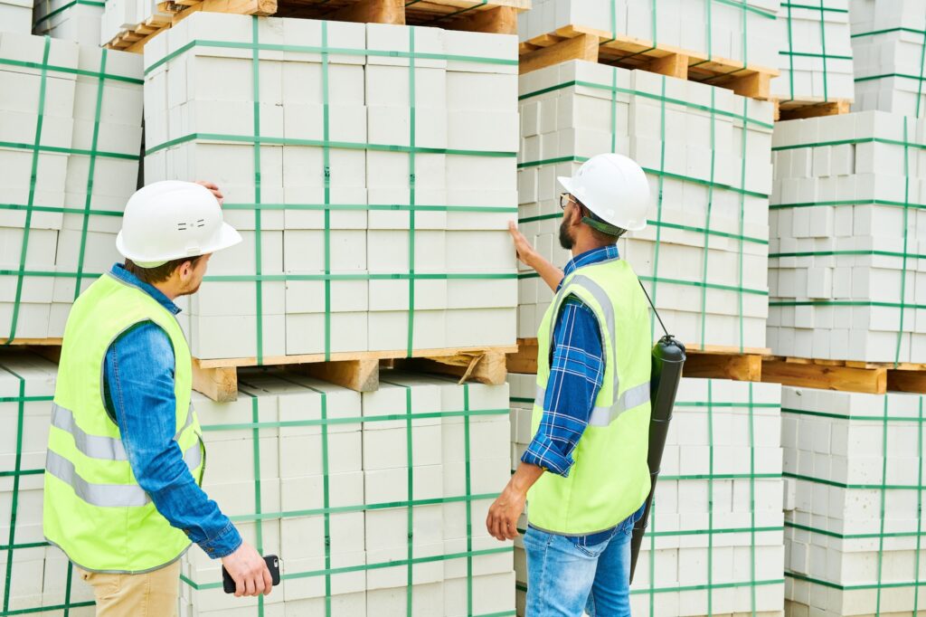 Servicii Anonymous building inspectors looking at materials